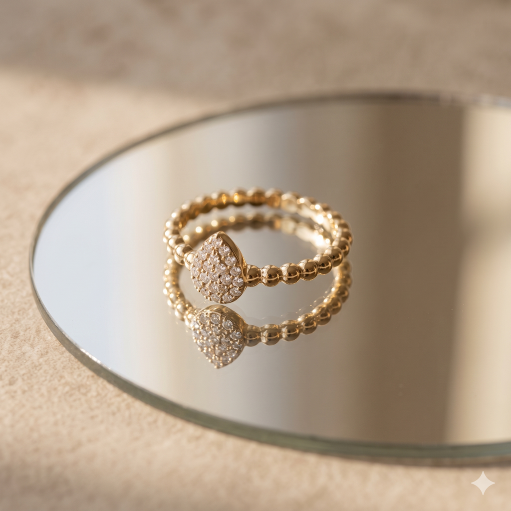 Gold beaded ring with pavŽ teardrop centerpiece