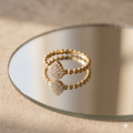Gold beaded ring with pavŽ teardrop centerpiece